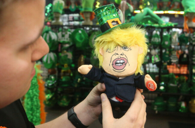 st-louis-united-states-11th-mar-2020-ethan-brock-listens-as-the-newest-talking-donald-trump-dolltweet-el-don-talks-while-wearing-a-st-patricks-day-hat-at-his-store-johnnie-brocks-dungeon